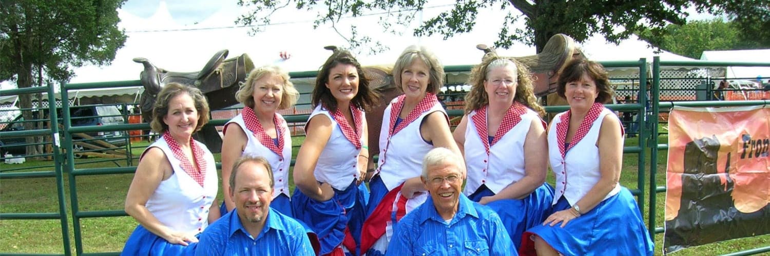 Bull Run Cloggers dancers in coordinated costumes during a performance.